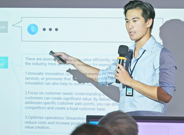 AI-in-EducationLeveraging-Chat-GPT-in-the-ClassroomLearning Elementary-age students smiling at laptop as they use AI safely to learn new topics in school