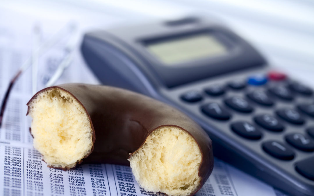 Closeup of calculator and donut illustrating example of computational thinking for students detailed later in this article