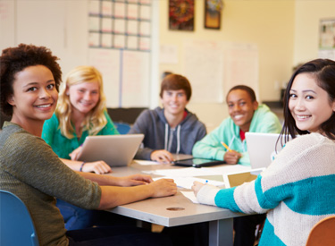 Teaching-AIEthical-Considerations-for-High-School-StudentLearning Two young female students thinking like programmers on a laptop in a classroom